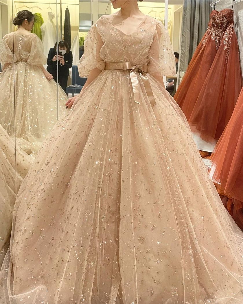 A collection of photos wearing the cute sparkly "Constellation Dress" by Marry with fluffy puff sleeves🪄🌟にて紹介している画像